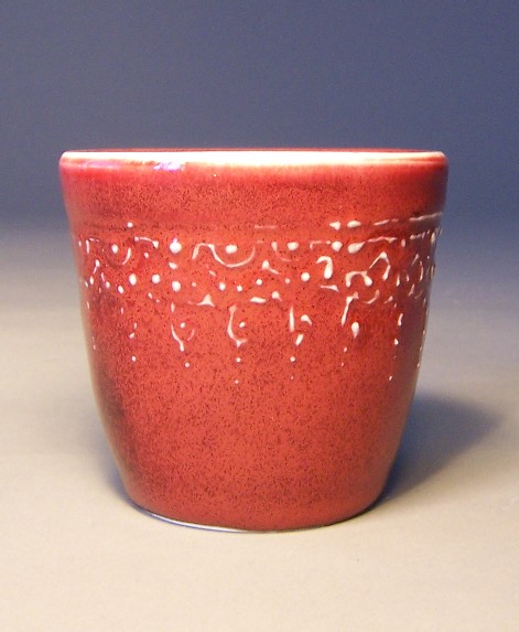 small red sliptrailed cup